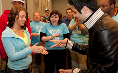Students playing rock paper scissors.