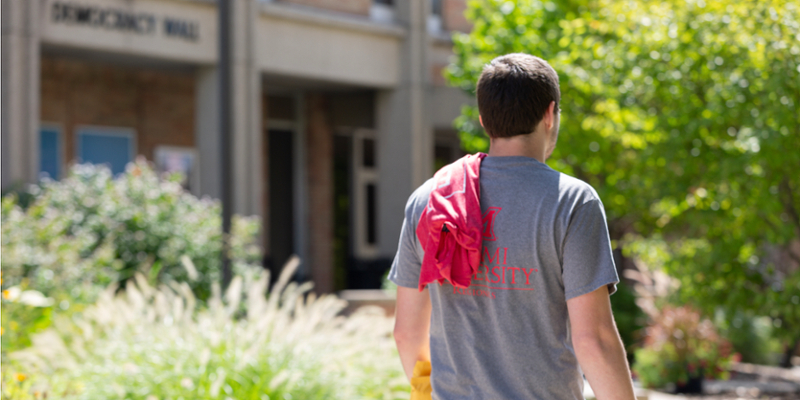 A student walking through campus. 