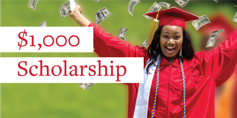 $1,000 Scholarship. Grad with hands in the air.