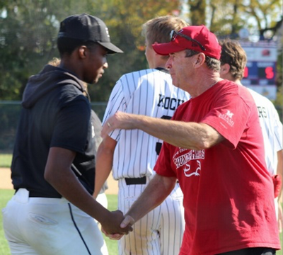 Mark Adams shaking the hand of a player.