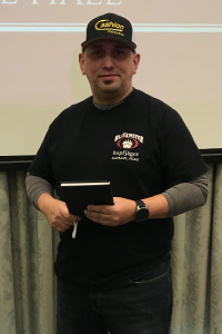 Dale Hall holds the Beccaria Award.