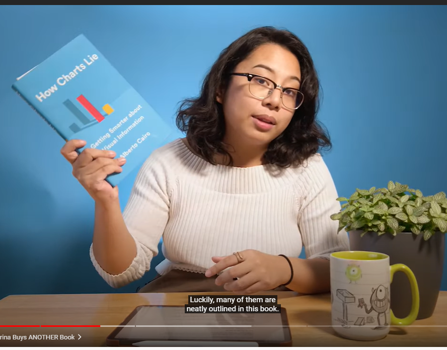 person holding blue book on blue background