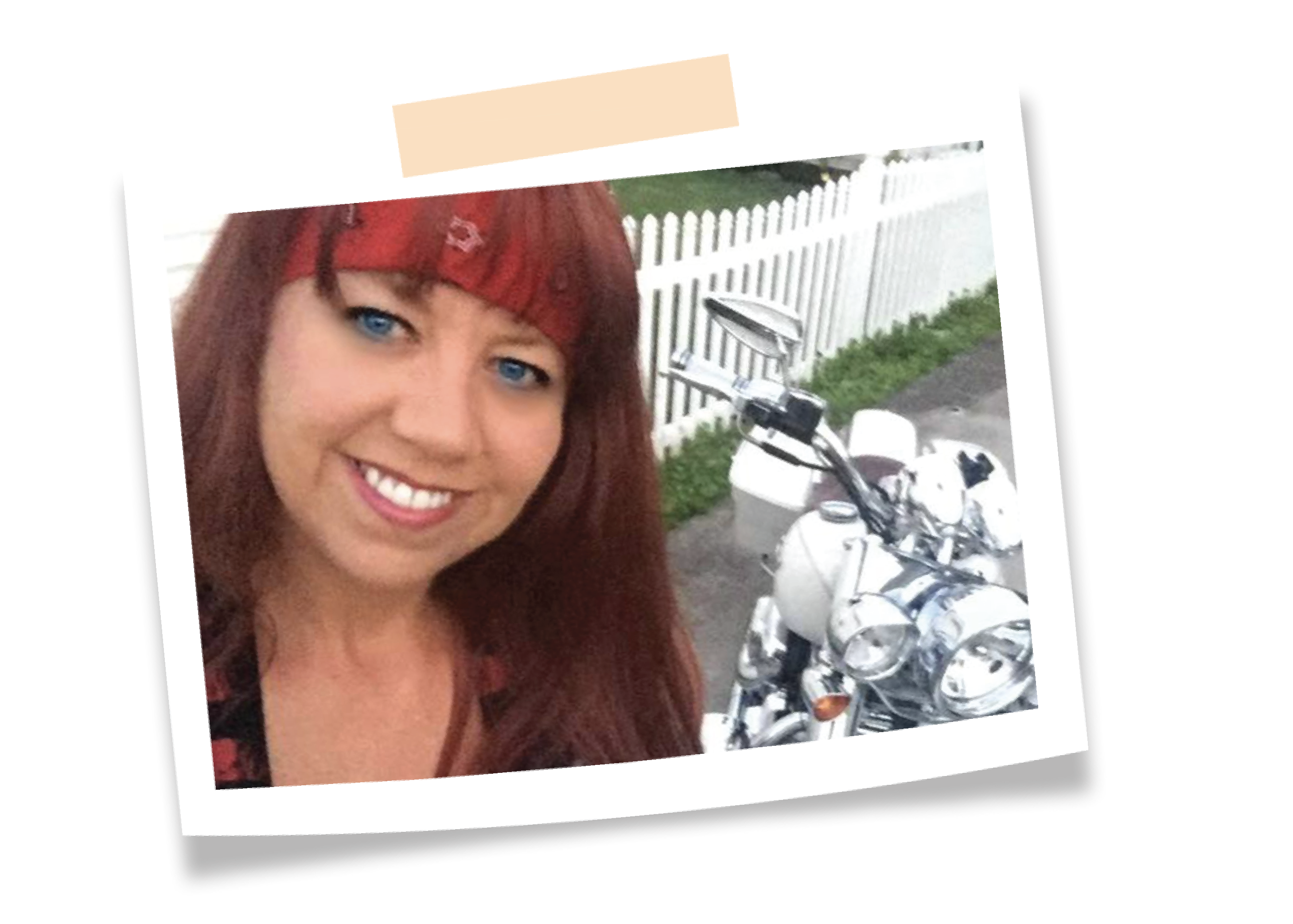 Kelly Starr standing next to her motorcycle
