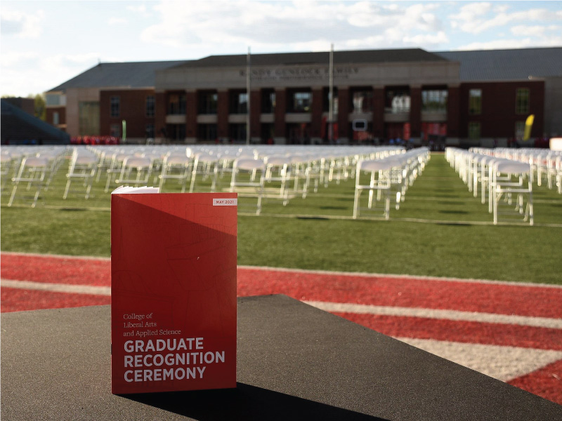 Graduate Recognition Ceremony brochure with Yager Stadium in the background. 