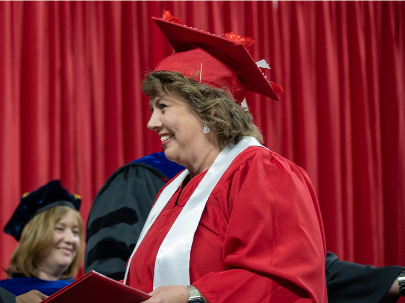 A Miami student receiving her diploma.
