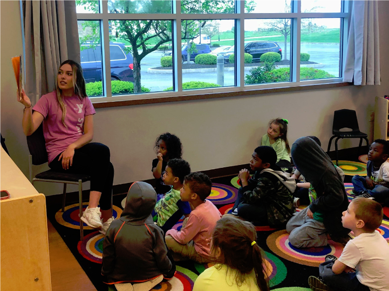 Sydney Glynn working in her YMCA pre-K classroom