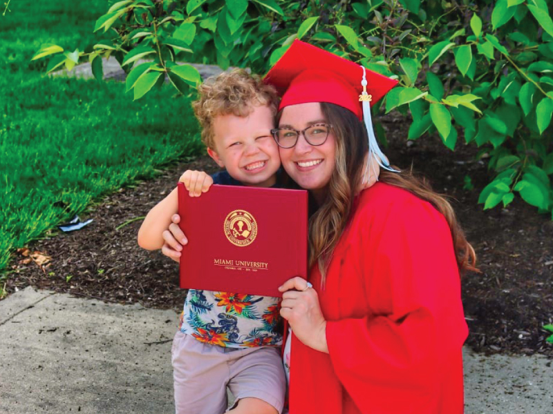Kara Reynolds and her son Leo during her graduation ceremony earning her associate degree.