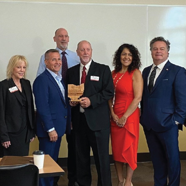 Front row from L to R: Holly Schultheis, Grants and Communications manager SBDC Everett Woodell, SBA Director Columbus District David Riggs, Director SBDC Karla Boldery, Business Adviser SBDC Tim Bingaman, Business Adviser SBDC Back row: James Buckner, Associate Director SBDC