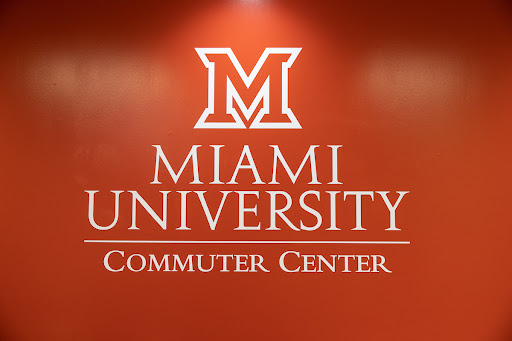 Red wall with a Miami logo for the Commuter Center