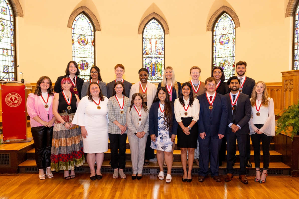 18 Miami students wearing medals at the Kumler Chapel. 