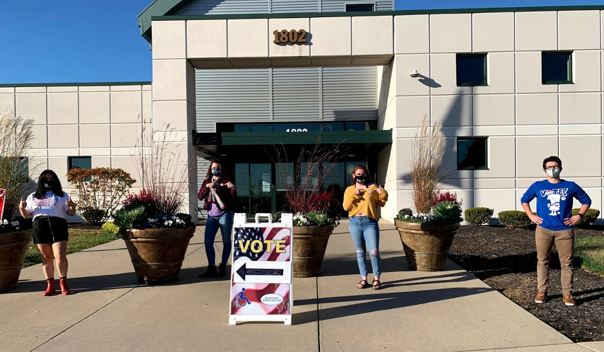 4 students physically distanced outside Butler County Board of Elections