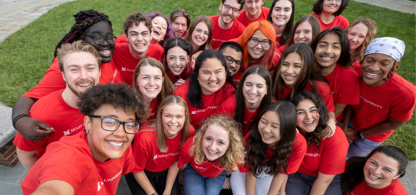 Selfie of a group of about 20 students (SOULs) in red Miami t-shirts