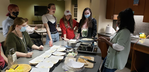 Students in the Environmental Awareness Living Learning Community learn how to cook tofu.