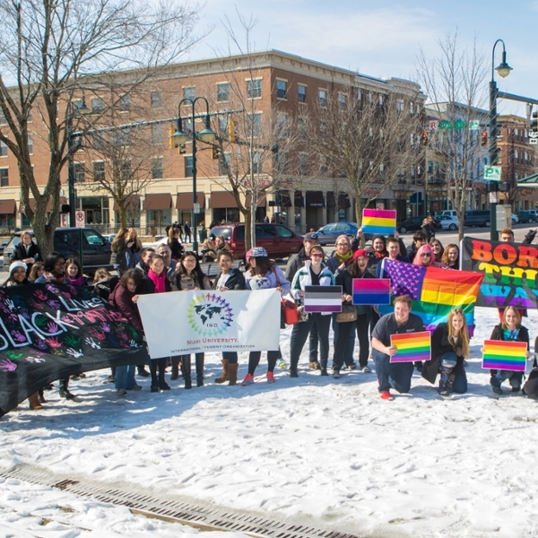  Group of about 40 students uptown finishing a march and holding signs that read Black Lives Matter, International Student Organization, and rainbow Born this Way