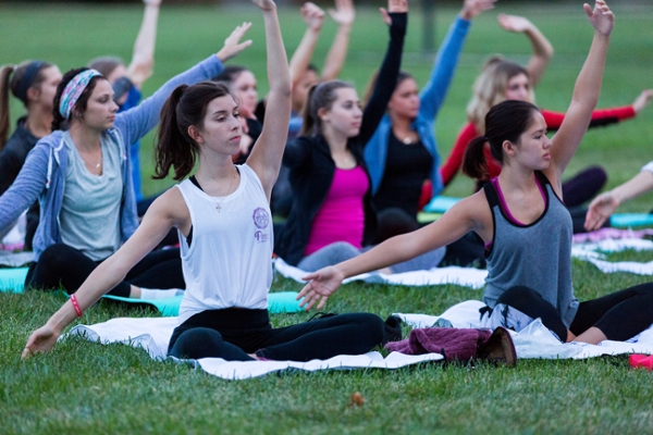  Group of students doing yoga on centra quad