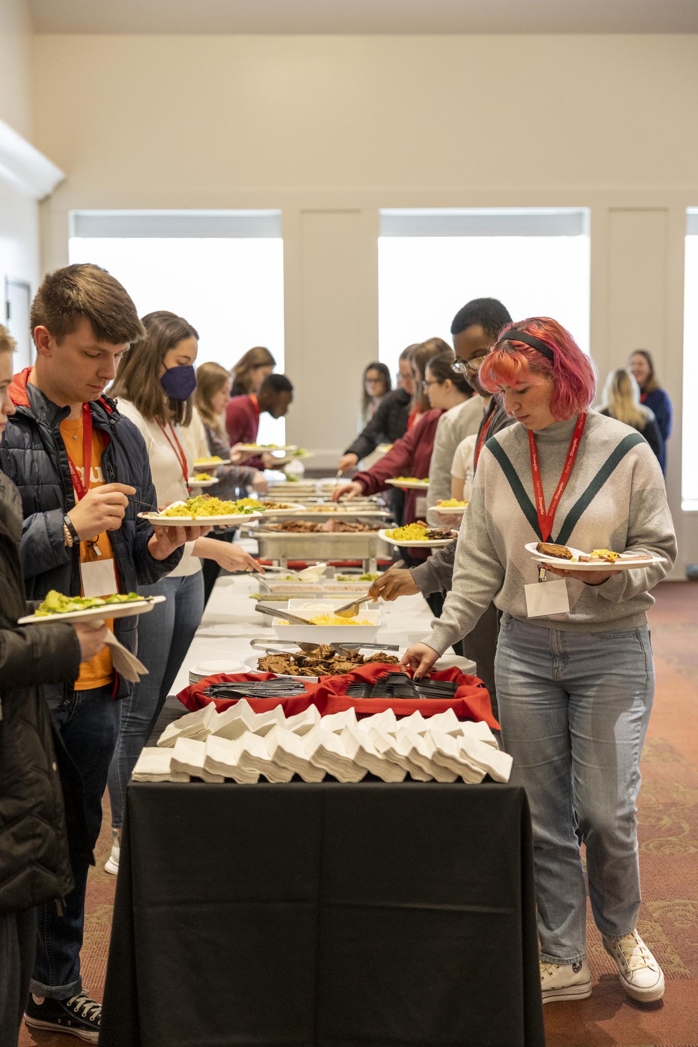 students at catering buffet line during Perlmutter Leadership Conference