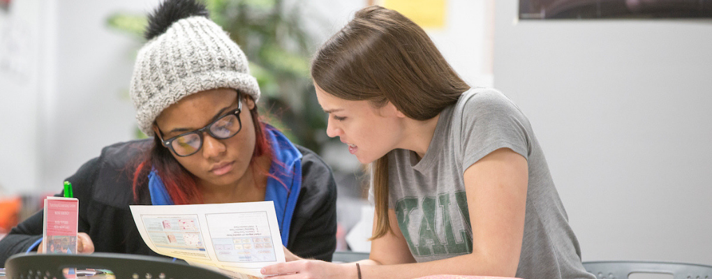 Students reviewing a paper together