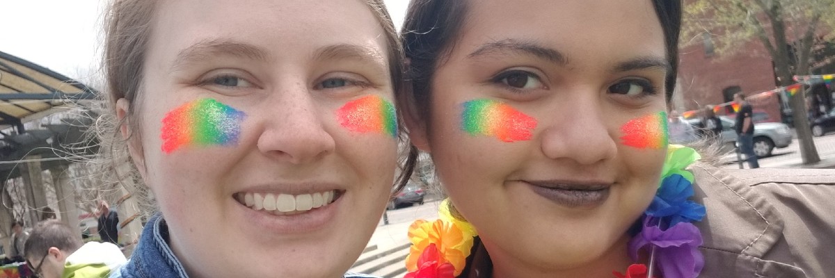  two students with rainbow face paint