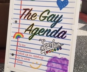 Framed sign that reads The Gay Agenda. Spectrum. To do: Homework, catch up on reading, go to work, sleep