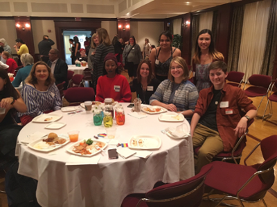 Students around a round table in Shriver at the Rianbow Reception