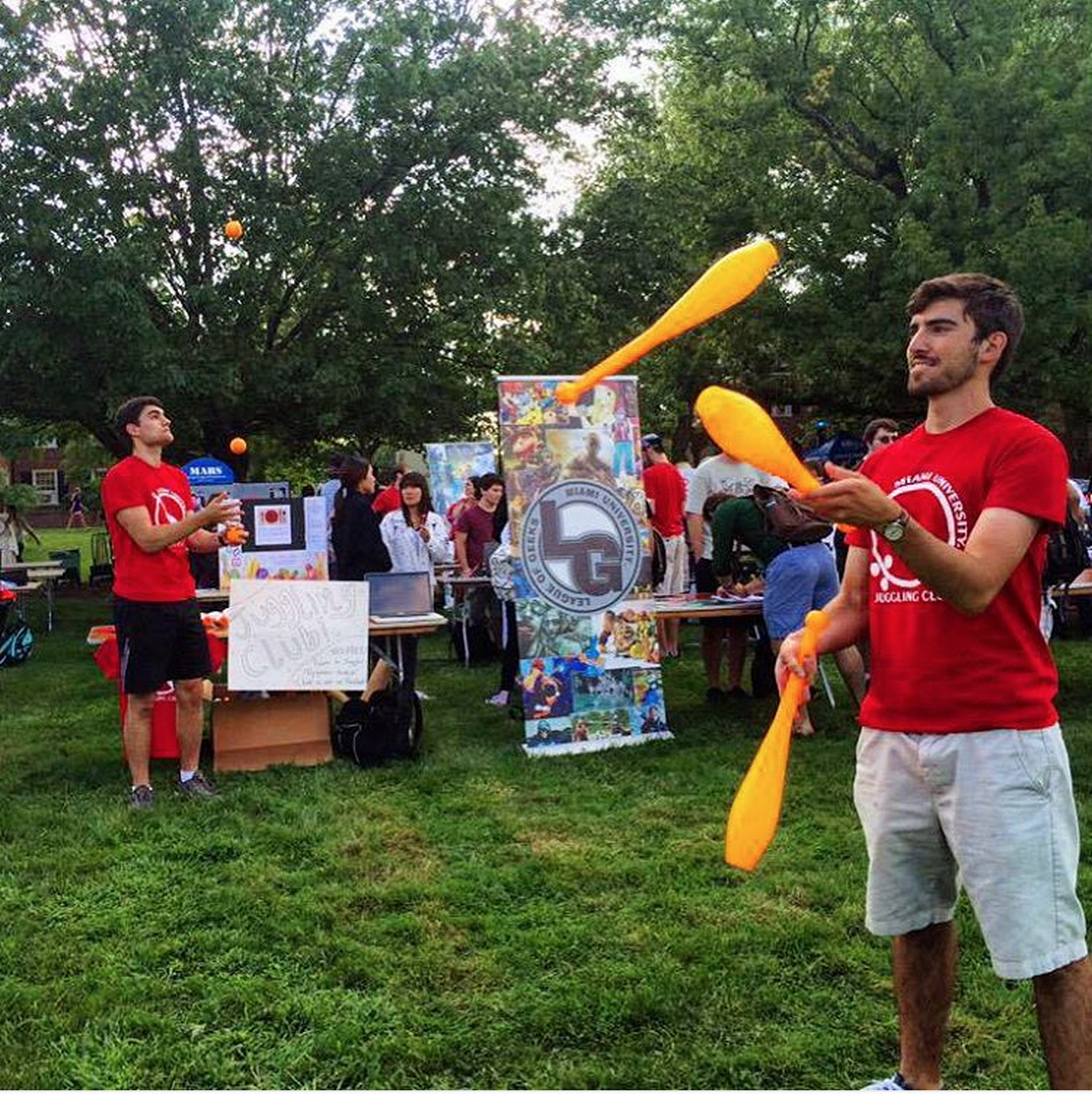  Two students from Miami's Juggling Club juggle during the Megafair event on campus.