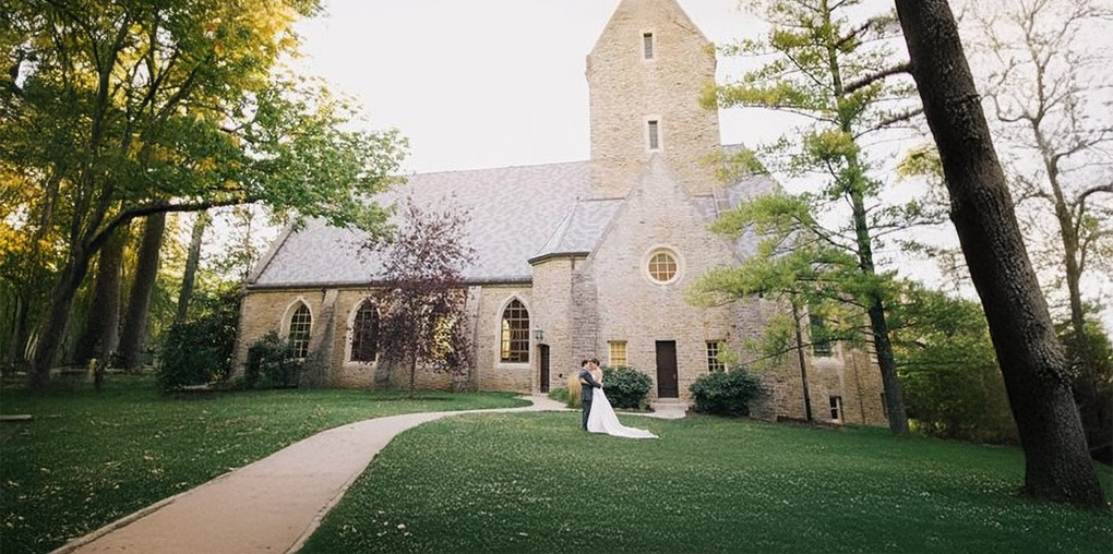 bride and groom outside kumler chapel